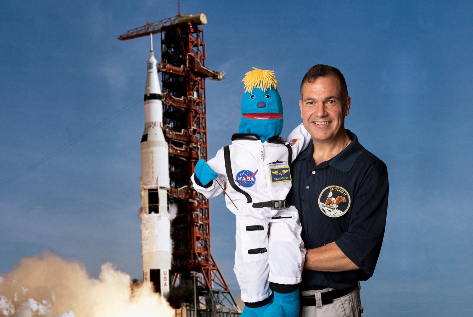 NASA-inspired promotional portrait with a performer and character